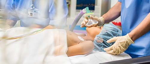 Photo of a child in an operating room.