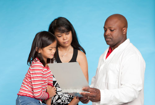 Child and parent with radiologist.