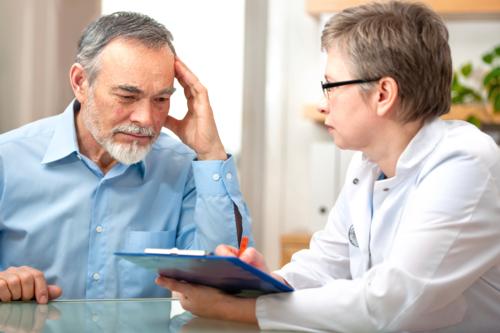 Photo of a radiologist and patient consultation.