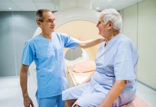 A photo of a radiologist with a patient