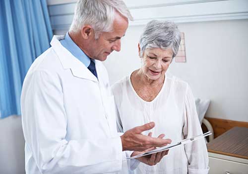 A photo of a radiologist with a patient.