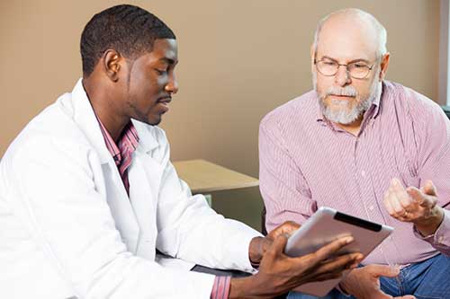 A photo of a patient consulting with a radiologist 