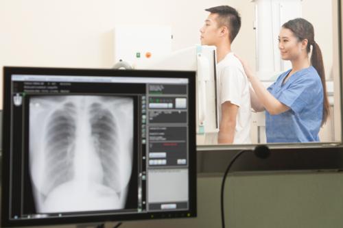 Photograph showing chest x-ray procedure