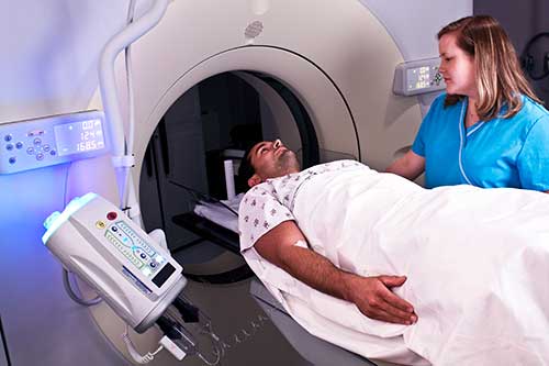 Photo of a patient during a computed tomography (CT) scan. 