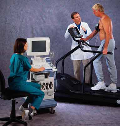 Technologist with patient and ultrasound system