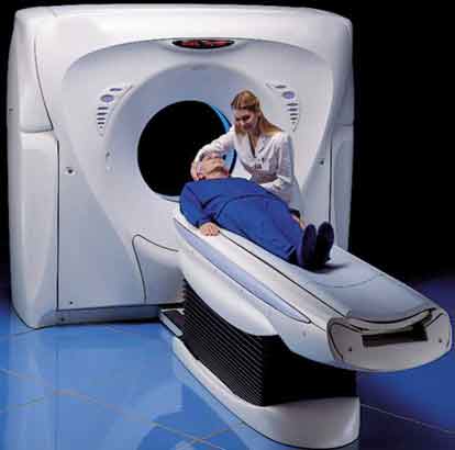 Technologist with patient undergoing computed tomography CT scan
