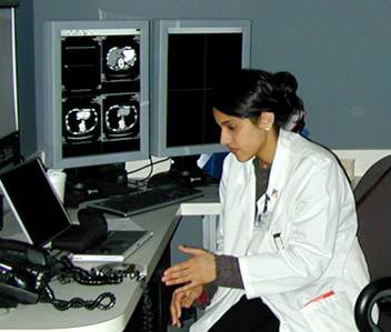 Radiologist reading computed tomography CT scans