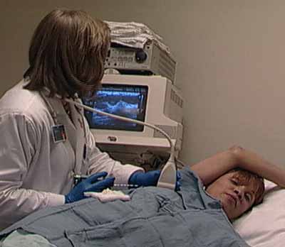 Patient undergoing ultrasound-guided breast biopsy