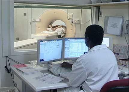 Technologist in control room for virtual colonoscopy